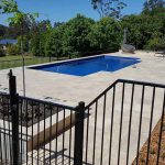 Black Fence Beside the Pool — Landscape Service in Australia