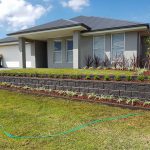 Grey House with landscaped front yard — Landscape Service in Newcastle