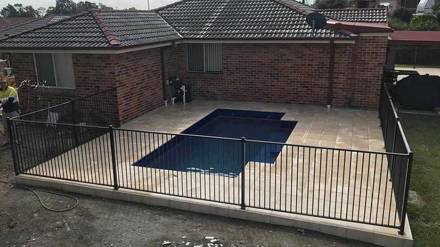 Small Pool with Black Fence — Landscape Service in Australia